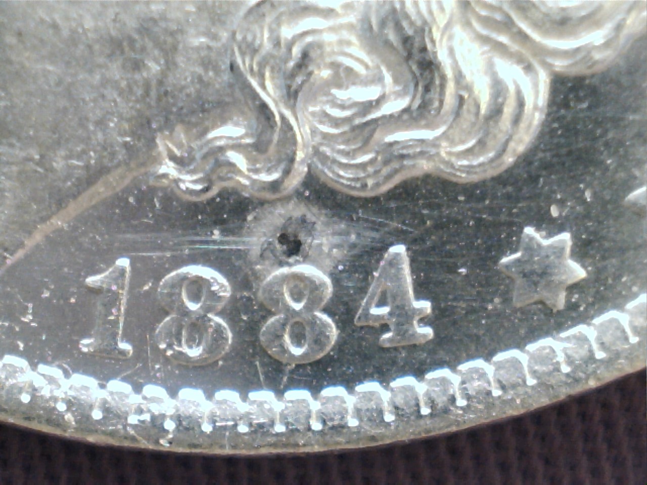 1884-O-Morgan-With-Small-But-Serious-Dark-Spot.