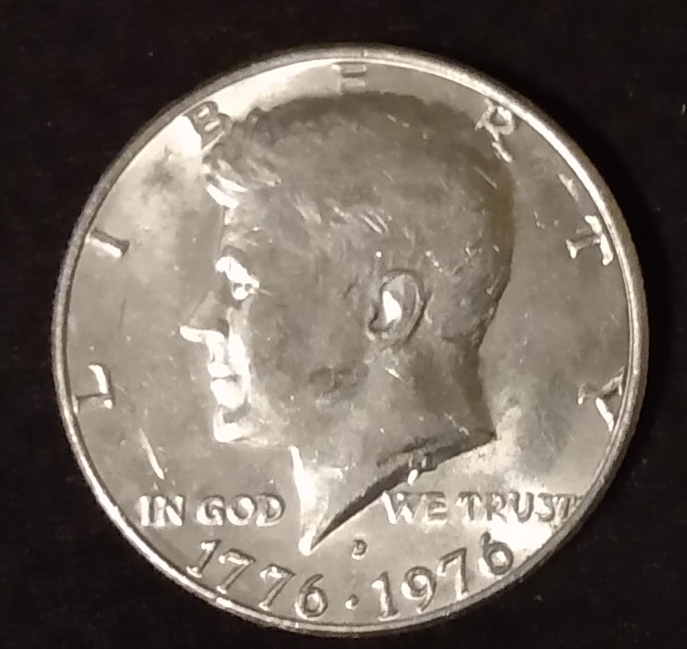 Can't-Tell-If-It-Scuffed-Or-A-Error-1776-1976-Kennedy-Half-Dollar