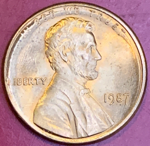 1987-Penny-Clear-Doubling,-But-What's-Up-With-This-Small-Extra-Letter-E?