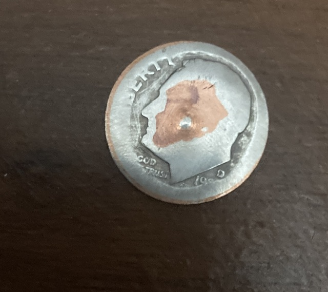 Smushed-Dime-The-Date-Is-From-1900-S-Maybe-1980-S-And-It-Has-The-Letter-D-On-It