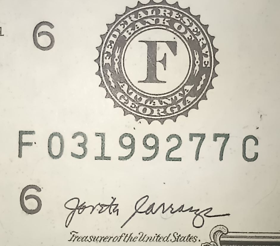 2017A-$1-Bill-With-One-Black-Serial-Number-And-One-Green-Serial-Number.