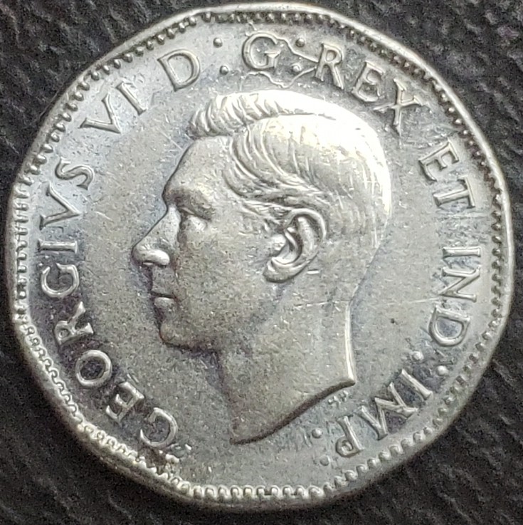 1945-Nickel-Struck-Through-String/Fabric?