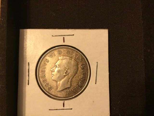 1940-50-Cent.-Off-Set-Die,-About-15-Deg.-Check-It-Out.