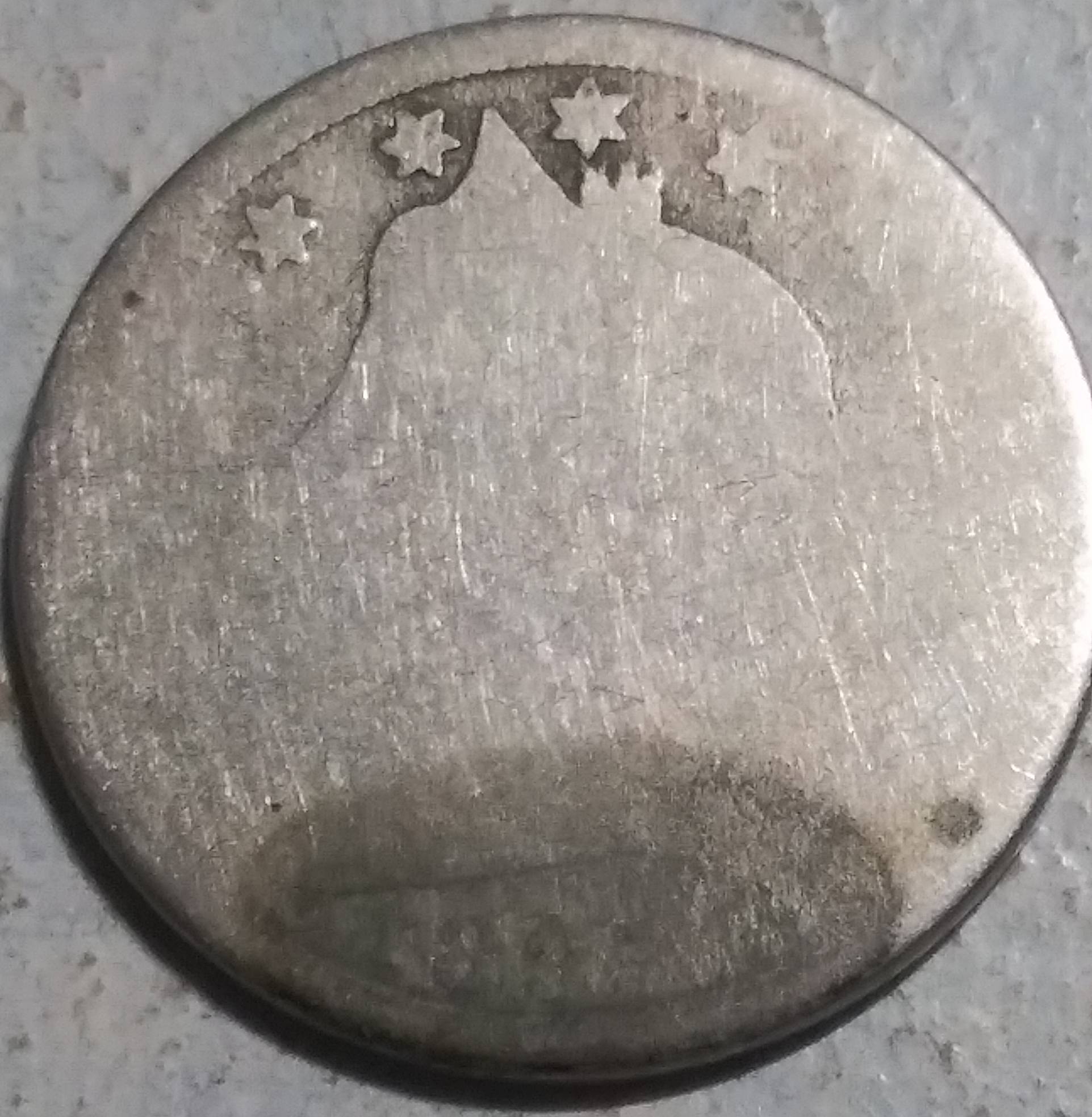 Beat-Up.-And-Battered-Barely-Recognizeable-Coin