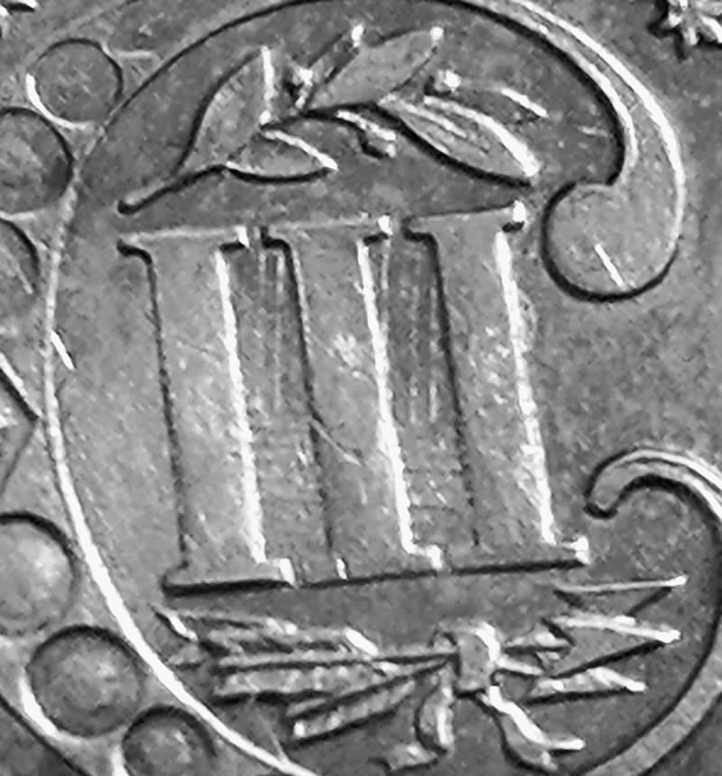 Help!-Very-Nice-Silver-Trime-With-What-Looks-Like-A-Strike-Through.