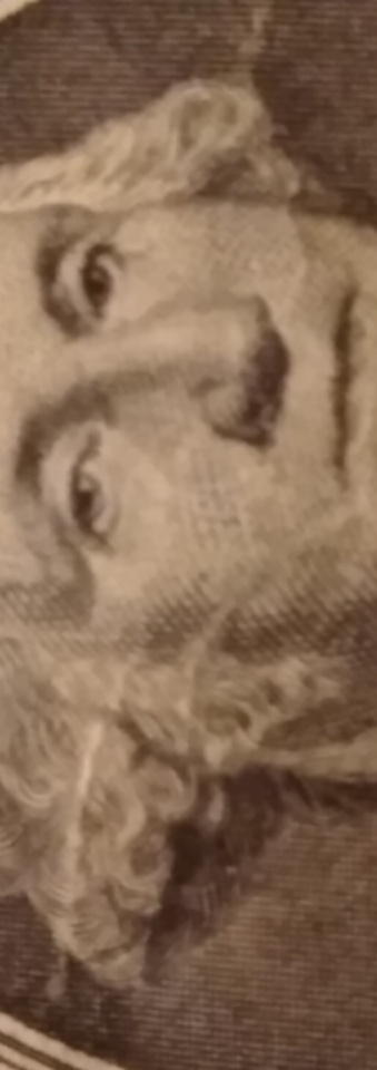 2013-Dollar-Bill-Looks-Like-Thread-Is-Through-Face