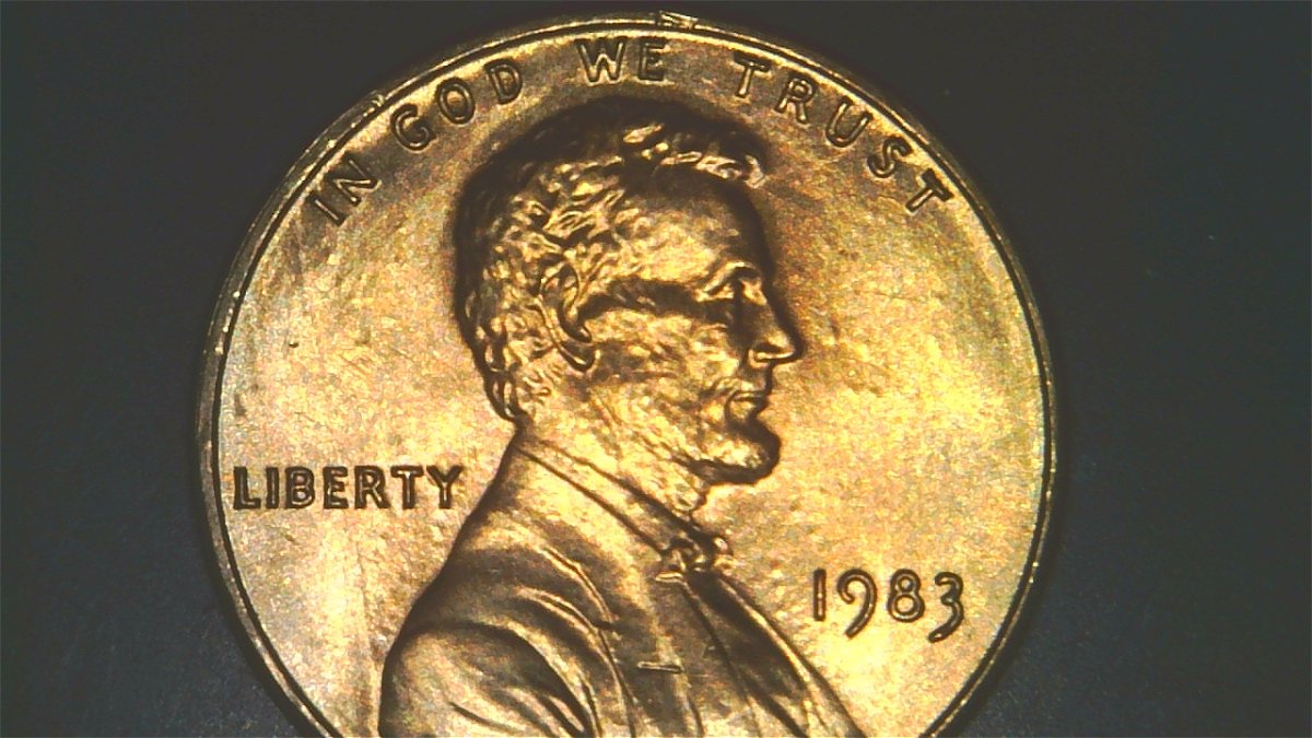 1983-LMC-Extra-Partial-E-On-Rim-Of-We-On-Obverse