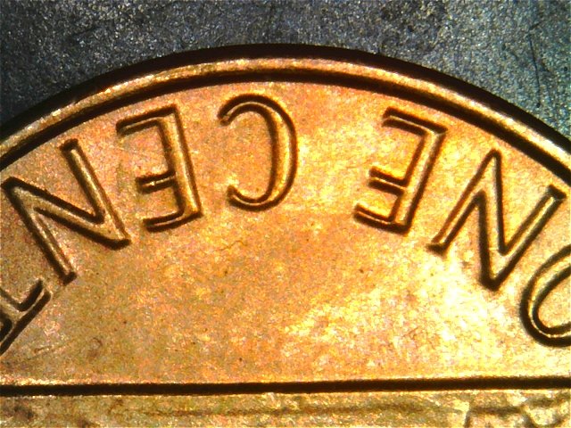 1983-LMC-Extra-Partial-E-On-Rim-Of-We-On-Obverse