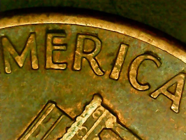 Are-The-Deep-Marks-Above-America-On-This-1990-D-Penny-Extreme-MD?