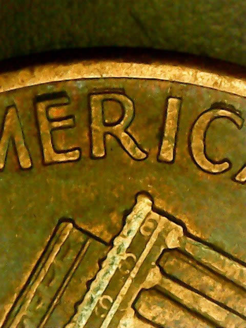 Are-The-Deep-Marks-Above-America-On-This-1990-D-Penny-Extreme-MD?