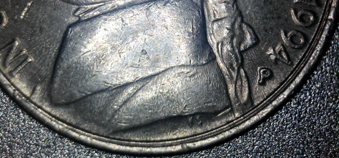 Error-Or-Minting-Mistake-Found-On-A-1994-P-Nickel-Collar-Area.