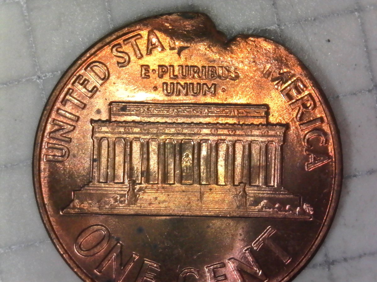 1959-Penny-Not-Sure-If-Error,-Clipped-Or-Just-Damaged.