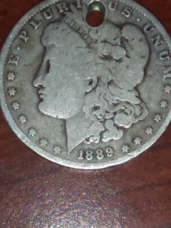 Are-These-US-Coins-Worthless-If-They-Have-A-Whole-Through-Them?