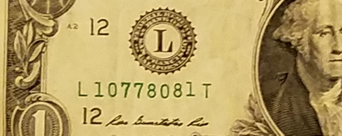 Uneven-Serial-Number-On-A-1-Dollar-Bill