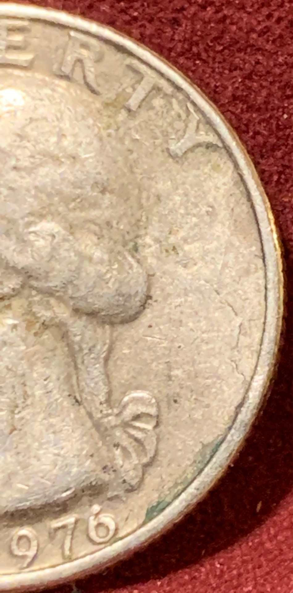 1976-Bicentennial-Quarter,-Badly-Battered.-Is-It-Damaged-From-The-Mint-Or-Old-Age?
