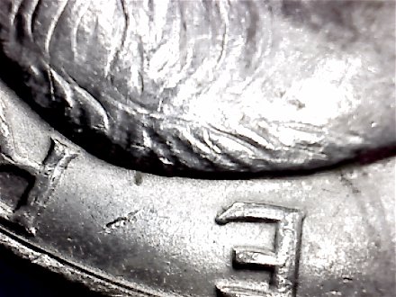 1971-Ike-Dollar-With-Something-Underneath-The-Strike?-Doubling-As-Well-Help