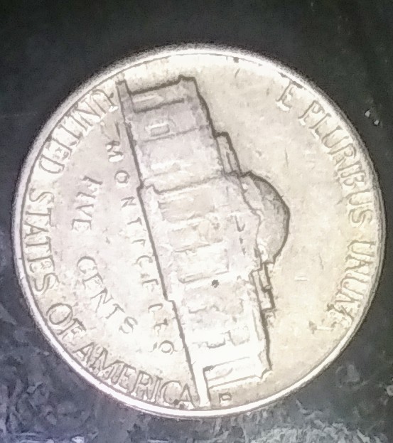 1964-D-Jefferson-Nickel-Struck-Over-A-Different-Coin?