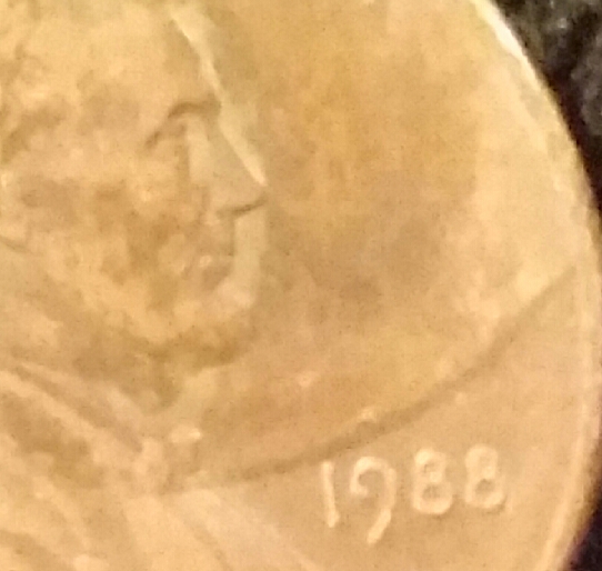 1988-D-Lincoln-Penny-With-A-Size-Of-A-Penny-On-Part-Of-Lincoln's-Head-Obv