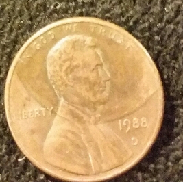 1988-D-Lincoln-Penny-With-A-Size-Of-A-Penny-On-Part-Of-Lincoln's-Head-Obv
