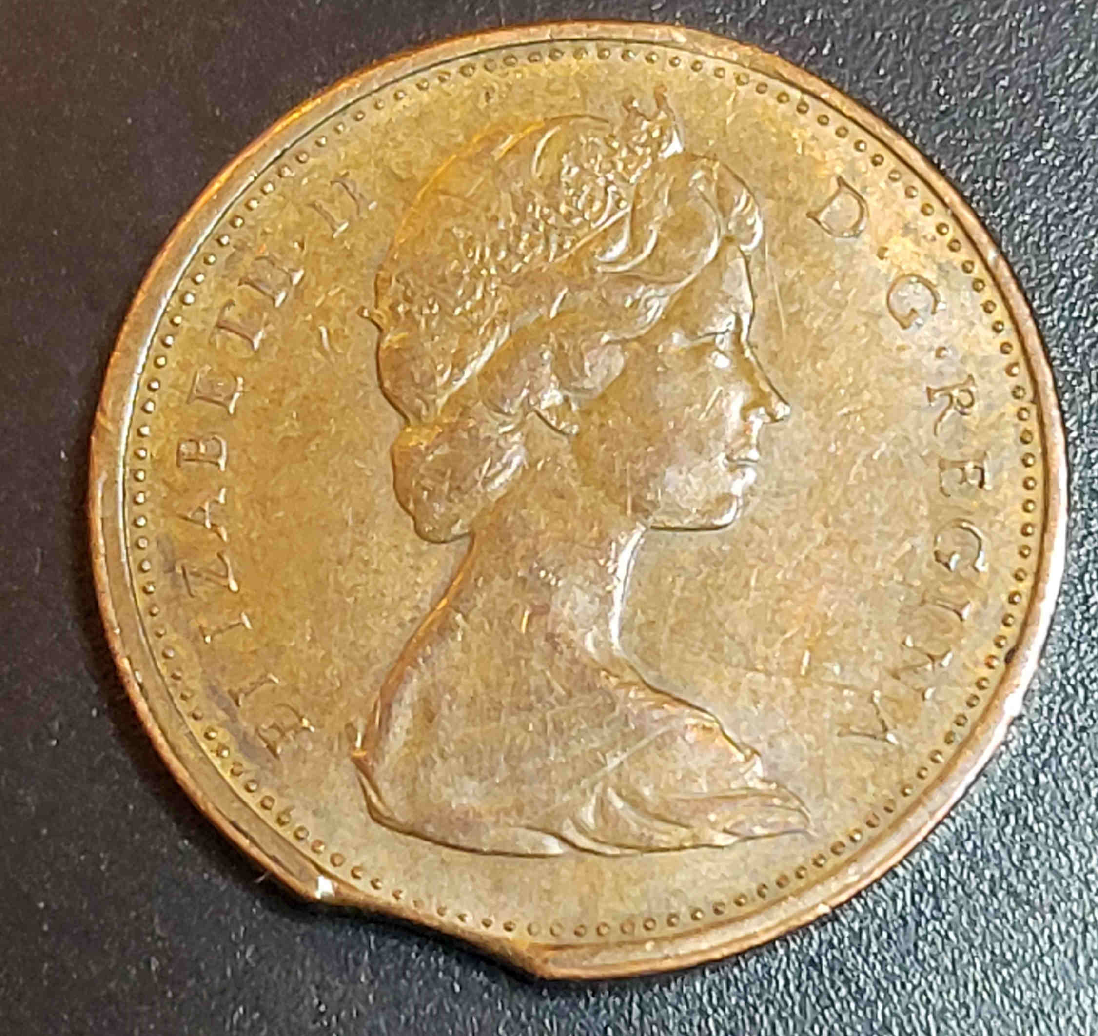 Clipped-Planchet-On-1973-Canadian-1-Cent--?