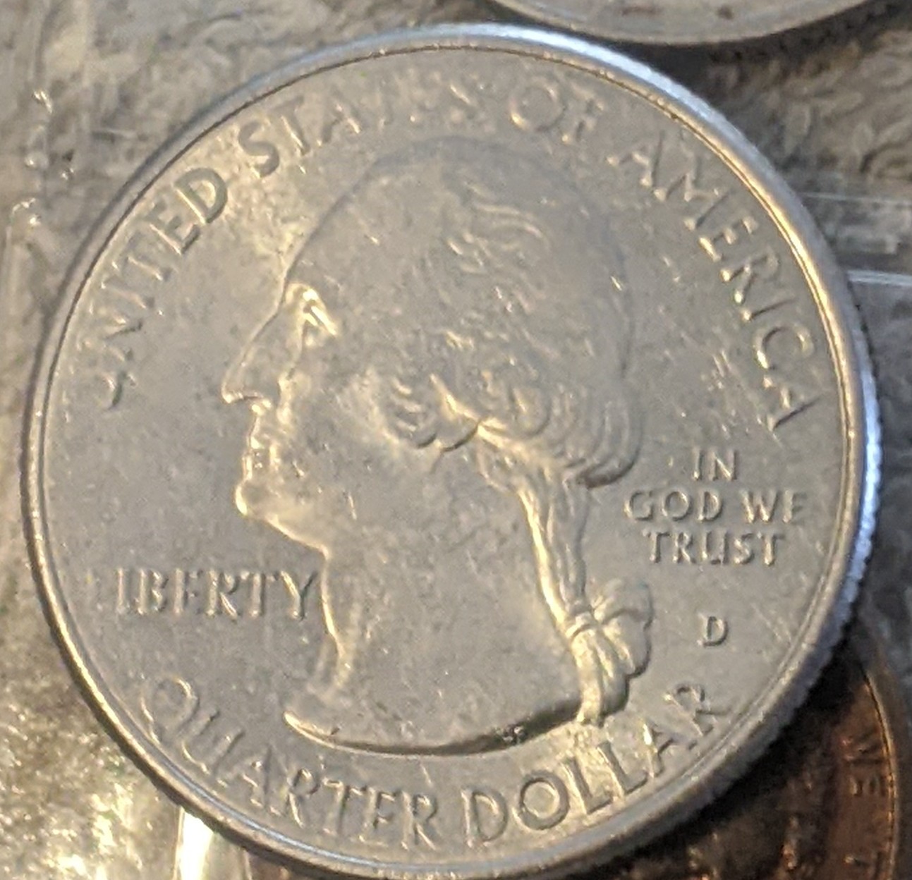 2019-Quarter-Looks-Like-Opposite-Edge-Clad-Layer-Folded-Over-The-Edge-Of-The-Coin-And-Was-Struck