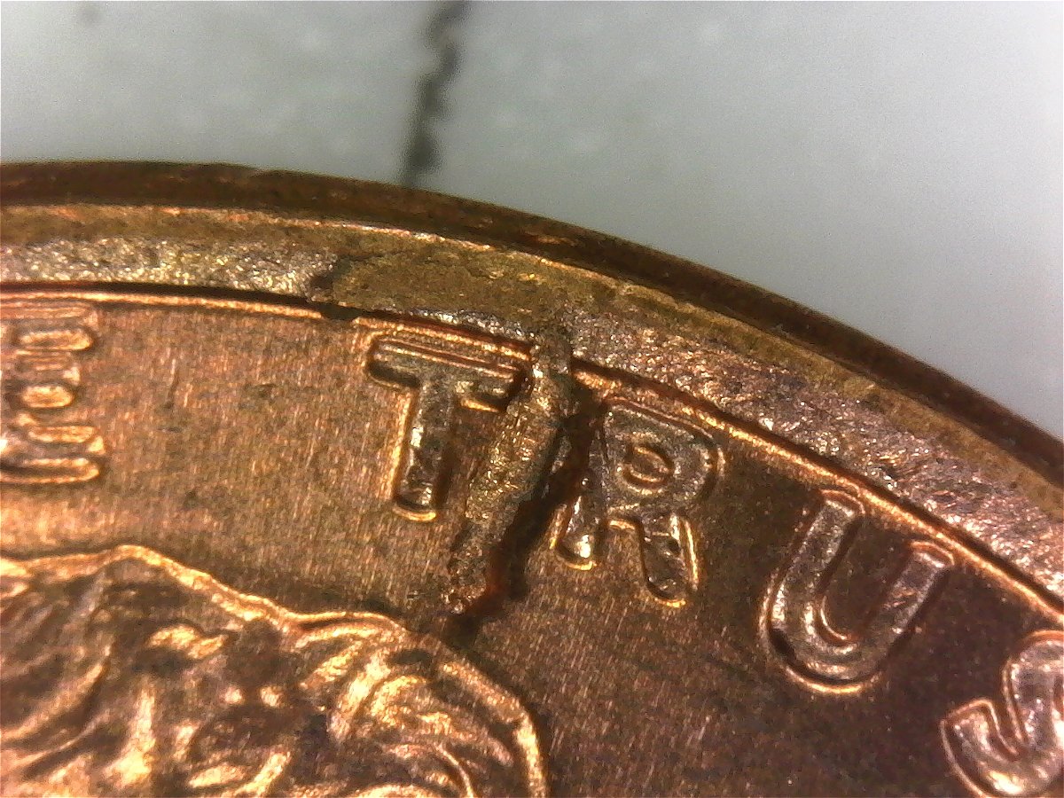 1974-D-LMC-BU-Rim-Pulled-Off-Strike-Through?