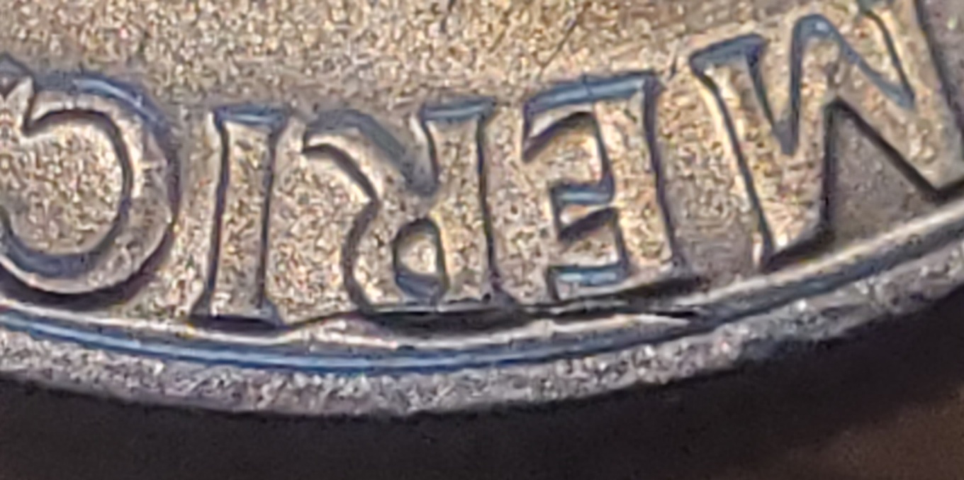 Bicentennial-Kennedy-Half-Dollar-Die-Crack?-The-Mark-Is-Raised-On-The-E-And-R-In-America
