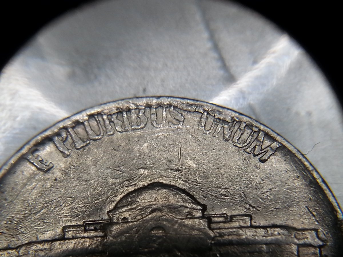 Rim-Cuds-On-1858-Flying-Eagle-Cent-And-1975-D-Nickel?