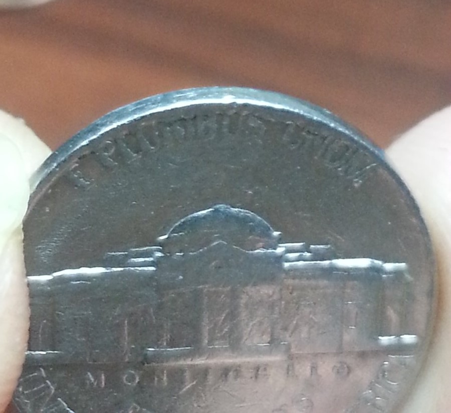 Rim-Cuds-On-1858-Flying-Eagle-Cent-And-1975-D-Nickel?