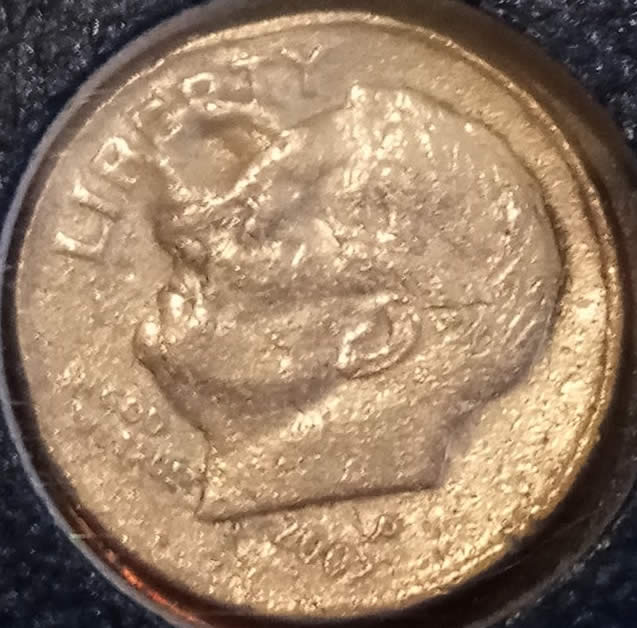 2002-Dime,-With-A-Bubble-On-The-Face-And-Metal-Missing-From-The-Side