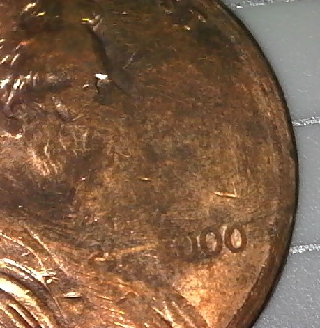 Is-This-2000-Penny-Damaged-Enviromentally-Or-By-Mint
