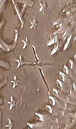 1964-Kennedy-Half-With-3-X-Shaped-Die-Crack-Marks-On-It