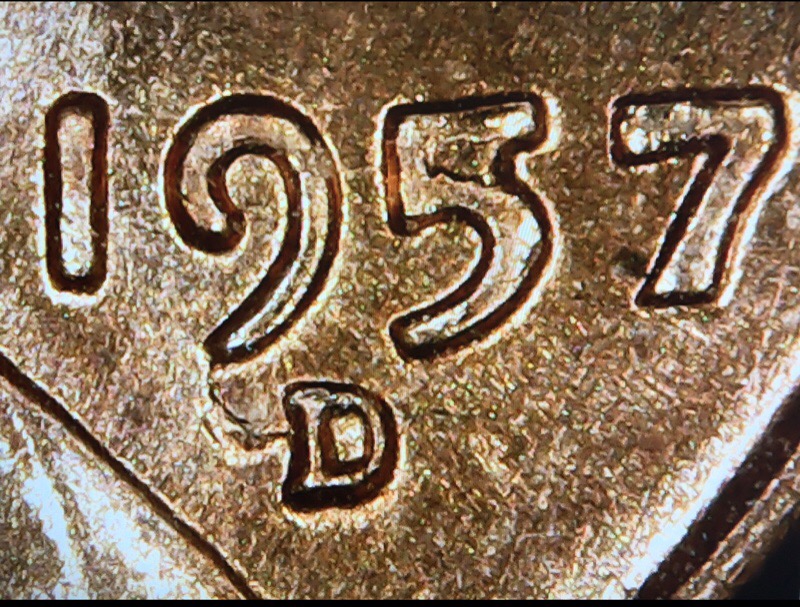 1957-D-LWC-Die-Break-On-Head,-Date,-And-What-Looks-Like-A-Wing-On-The-MM?