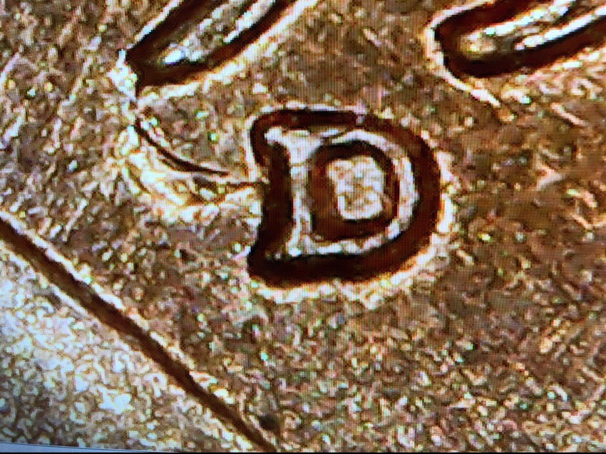 1957-D-LWC-Die-Break-On-Head,-Date,-And-What-Looks-Like-A-Wing-On-The-MM?