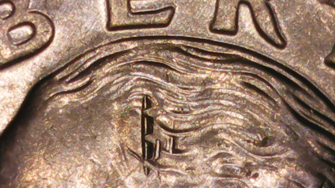 2021-Quarter-Impaled-With-Vertical-Spikes.-Not-A-Scratch-Nor-A-Strike-Thru.--What-Is-It?