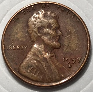 1957-D-Wheat-Penny-With-Another-Coin-Print-Over-Top?