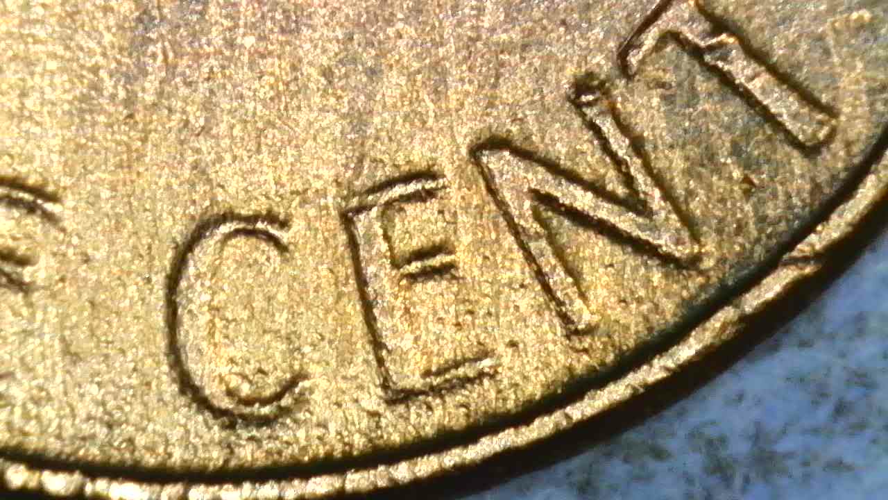 1976-D-Cent-What-Have-I-Found?--Bleb,-Occluded-Gas-Bubbles,-Flow-Lines,-Parallel-Lines?