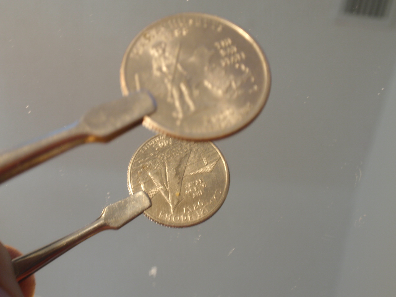 Different-States-On-Each-Side-Of-A-Quarter.