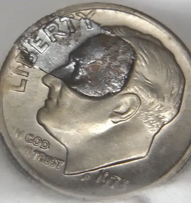 1973-Roosevelt-Dime-Retained-Strike-Through-Debris