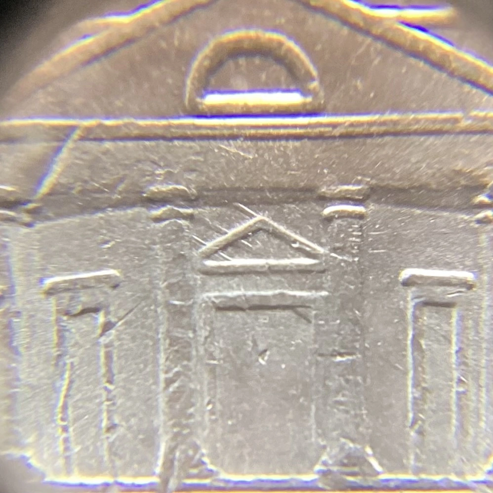 2013-P-Nickel-With-Feeder-Finger-Damage.