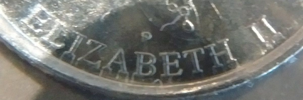 Possible-Die-Misalignment-On-2001-Year-Of-Volunteers-Dime-&-Extra-Thick?