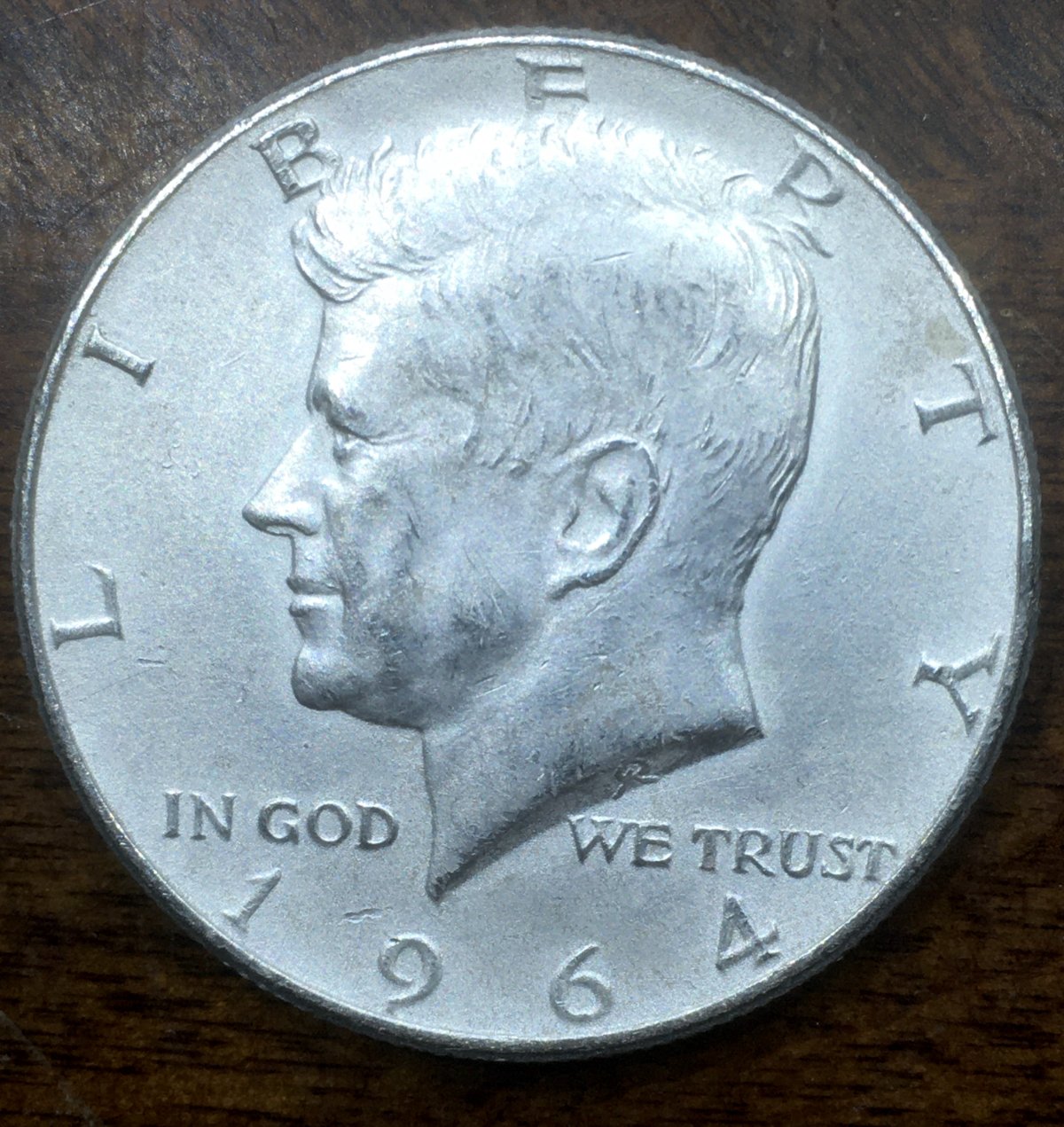 What-Kind-Of-1964-Kennedy-Half-Dollar-Looks-Frosty-All-Over-Like-This?