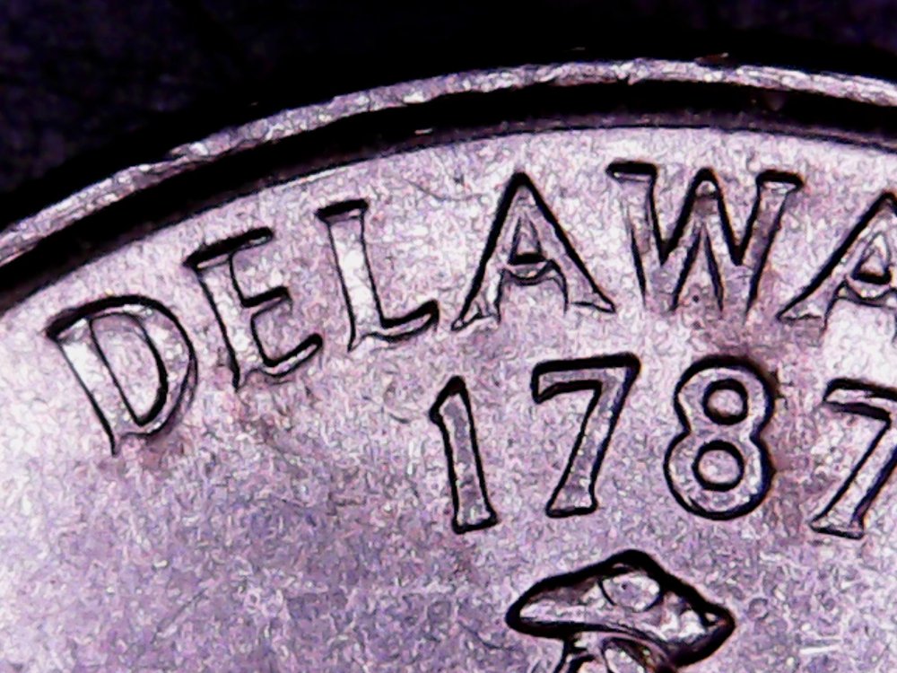 1999-Delaware-State-Quarter.-What-Is-Going-On-With-This-Letters?