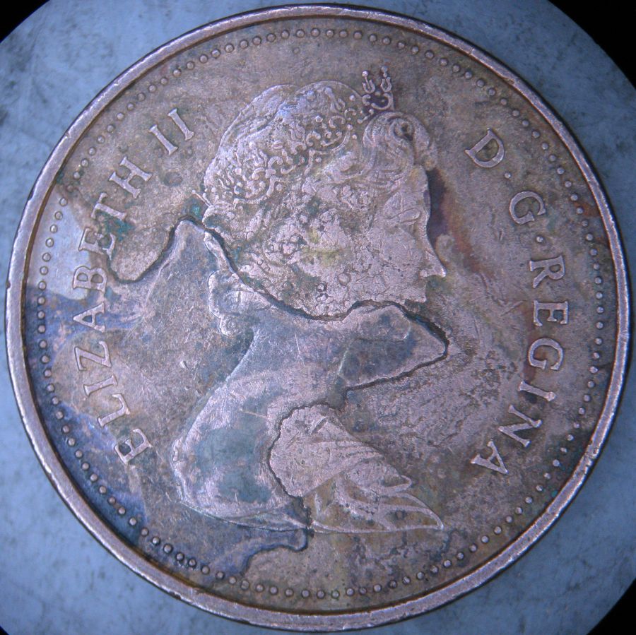1981-Canadian-1-Cent-Struck-Through-A-Very-Long-Thread