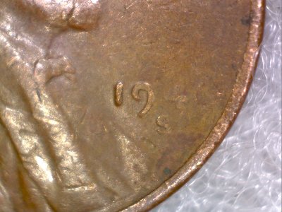 1946,-Or-A-1940-S-Wheat-Penny-Struck-Through-Grease?