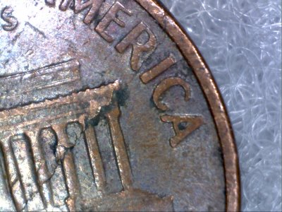 1966-Lincoln-Penny,-Lamination-Error-Across-Obverse-And-?