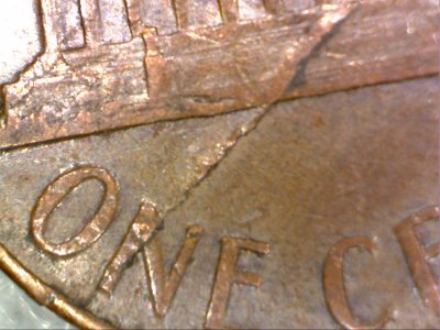 1966-Lincoln-Penny,-Lamination-Error-Across-Obverse-And-?
