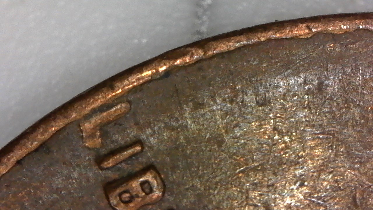 1964-D-LMC-With-Either-Rim-Cud,-Struck-Through-Debris,--Or-Lam-Help-Please