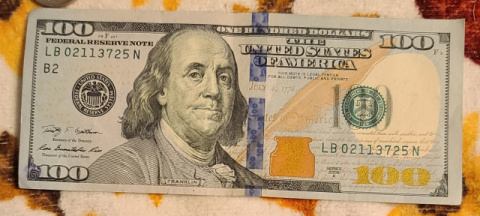100-Dollar-Bills-With-Small-Ink-Stamps-On-The-Reverse