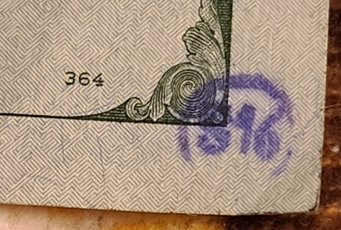 100-Dollar-Bills-With-Small-Ink-Stamps-On-The-Reverse